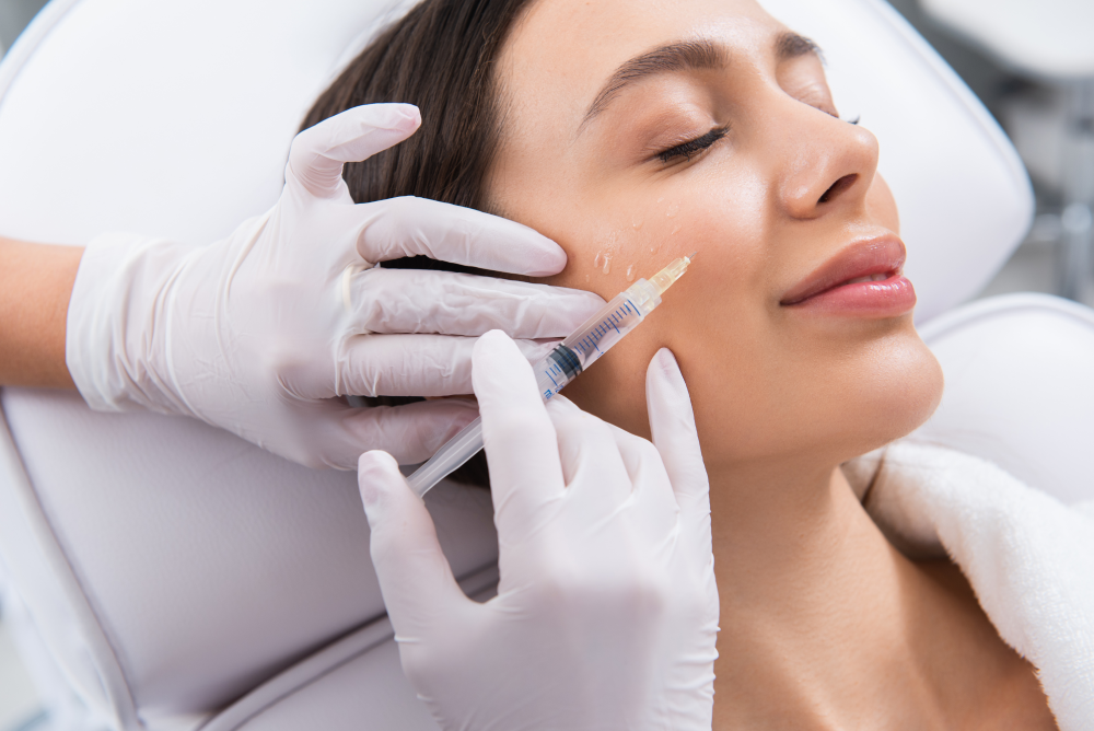 Woman receiving facial fillers in a clinical setting