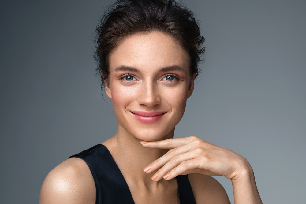 Woman shows youthful, V-shaped face after HIFU treatment.